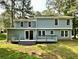 Expansive backyard with a deck and sliding glass doors at 4970 Clubgreen Smt, Stone Mountain, GA 30088