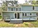 Expansive backyard with a deck and sliding glass doors at 4970 Clubgreen Smt, Stone Mountain, GA 30088
