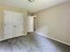 Bedroom featuring neutral paint and carpet, along with a closet and entry door at 4970 Clubgreen Smt, Stone Mountain, GA 30088