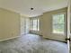 Bedroom featuring a closet, large double windows and neutral walls and carpet at 4970 Clubgreen Smt, Stone Mountain, GA 30088