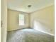 Bedroom featuring fresh neutral paint and carpet, a window and smooth ceilings at 4970 Clubgreen Smt, Stone Mountain, GA 30088