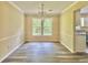 Open dining room area featuring hardwood floors and a chandelier at 4970 Clubgreen Smt, Stone Mountain, GA 30088
