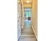 Inviting hallway showcasing modern floors, neutral walls, and abundant natural light at 4970 Clubgreen Smt, Stone Mountain, GA 30088