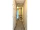 Upstairs hallway with white doors, neutral walls and carpet, with a stairway in view at 4970 Clubgreen Smt, Stone Mountain, GA 30088