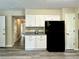 Kitchen area with granite counters, white cabinets and stainless steel refrigerator at 4970 Clubgreen Smt, Stone Mountain, GA 30088