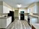Kitchen featuring white cabinets, granite countertops, and stainless steel appliances at 4970 Clubgreen Smt, Stone Mountain, GA 30088