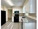Kitchen featuring white cabinets, granite countertops, and stainless steel appliances at 4970 Clubgreen Smt, Stone Mountain, GA 30088