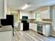 Kitchen featuring white cabinets, granite countertops, and stainless steel appliances at 4970 Clubgreen Smt, Stone Mountain, GA 30088