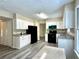 Kitchen featuring white cabinets, granite countertops, and stainless steel appliances at 4970 Clubgreen Smt, Stone Mountain, GA 30088