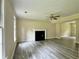 Living room featuring modern flooring, a fireplace, and an open layout at 4970 Clubgreen Smt, Stone Mountain, GA 30088