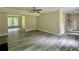 Bright living room with modern floors, an open layout, and natural light at 4970 Clubgreen Smt, Stone Mountain, GA 30088