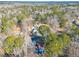 An aerial view of homes on wooded lots, showcasing the density of the surrounding trees and landscape at 2139 Logan Dr, Jonesboro, GA 30236