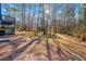 Beautiful backyard of two-story home with deck and wooded area at 2139 Logan Dr, Jonesboro, GA 30236