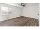 Bright bedroom with wood flooring, ceiling fan, and large window at 2139 Logan Dr, Jonesboro, GA 30236