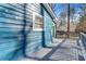 Back deck with blue wood siding and grey floors at 2139 Logan Dr, Jonesboro, GA 30236