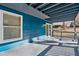 Back deck with blue wood siding overlooks a wooded area at 2139 Logan Dr, Jonesboro, GA 30236