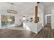 Large open kitchen and dining space, featuring bright white cabinets and stainless appliances at 2139 Logan Dr, Jonesboro, GA 30236