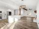 Open kitchen and living space featuring wood floors, an island, and stainless steel appliances at 2139 Logan Dr, Jonesboro, GA 30236