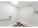 Clean laundry room with hookups and neutral decor at 2139 Logan Dr, Jonesboro, GA 30236