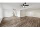 Spacious living room with wood-look floors, ceiling fans, and ample natural light at 2139 Logan Dr, Jonesboro, GA 30236
