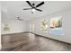 Spacious living room featuring hardwood floors, bright natural light, and a ceiling fan at 2139 Logan Dr, Jonesboro, GA 30236