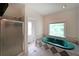 Bathroom with a shower stall and large jacuzzi tub under a bright window at 3265 Greenhill Ct, Villa Rica, GA 30180