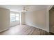 Well-lit bedroom with hardwood flooring, ceiling fan and closet at 3265 Greenhill Ct, Villa Rica, GA 30180
