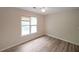 Bright bedroom with light-colored walls, ceiling fan, and a window providing natural light at 3265 Greenhill Ct, Villa Rica, GA 30180