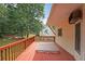 Relaxing outdoor deck featuring a hot tub and view of the lush backyard at 3265 Greenhill Ct, Villa Rica, GA 30180