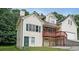 A charming home with a two-story layout, a front-facing garage, and a red porch with stone detailing at 3265 Greenhill Ct, Villa Rica, GA 30180