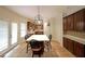 Eat-in kitchen with a large island, stainless appliances, and dark wood cabinets at 3265 Greenhill Ct, Villa Rica, GA 30180