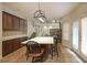 Eat-in kitchen with a large island, stainless appliances, and dark wood cabinets at 3265 Greenhill Ct, Villa Rica, GA 30180