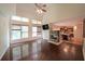 Spacious living room with hardwood floors, fireplace, and view into the kitchen at 3265 Greenhill Ct, Villa Rica, GA 30180