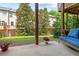 A cozy back patio with a blue cushioned wicker chair and a view of the backyard at 3690 Lambert Ne Ln, Atlanta, GA 30319