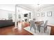 Open-concept living area with dining space with bright light and hardwood flooring at 3690 Lambert Ne Ln, Atlanta, GA 30319