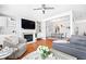 Bright living room featuring a fireplace, built-in shelves, and hardwood floors at 3690 Lambert Ne Ln, Atlanta, GA 30319