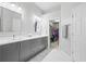 This bathroom features double sinks, granite counters, and a walk-in closet at 3690 Lambert Ne Ln, Atlanta, GA 30319