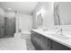 Modern main bathroom featuring double sinks, soaking tub, and glass enclosed shower at 3690 Lambert Ne Ln, Atlanta, GA 30319
