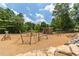 Community playground with climbing structures, slides, and wood chip ground cover at 3690 Lambert Ne Ln, Atlanta, GA 30319