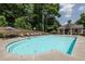 Community pool featuring a lounge area and shaded seating, perfect for relaxation at 3690 Lambert Ne Ln, Atlanta, GA 30319