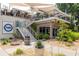Modern restaurant with outdoor seating on multiple levels and stylish landscaping at 3690 Lambert Ne Ln, Atlanta, GA 30319