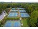 Aerial view of multiple community tennis courts surrounded by lush greenery at 3690 Lambert Ne Ln, Atlanta, GA 30319