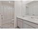 Bathroom featuring a double sink with granite countertops and a tub with shower at 4117 Flat Rock Pt, Stonecrest, GA 30038