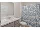 Bathroom featuring a vanity with marble countertop, toilet, and a shower with a patterned curtain at 4117 Flat Rock Pt, Stonecrest, GA 30038