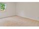 An empty bedroom with a window and carpet flooring at 4117 Flat Rock Pt, Stonecrest, GA 30038