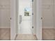 Walk-in closet with shelving, leading to a bathroom area with a window at 4117 Flat Rock Pt, Stonecrest, GA 30038