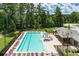 Aerial view of a sparkling community pool with plenty of lounge chairs at 4117 Flat Rock Pt, Stonecrest, GA 30038