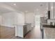 Bright kitchen featuring granite countertops, stainless steel appliances, and an island with a sink at 4117 Flat Rock Pt, Stonecrest, GA 30038