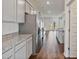 A well-lit kitchen with stainless steel appliances, granite countertops, and ample cabinet space at 4117 Flat Rock Pt, Stonecrest, GA 30038