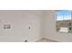 Clean and bright laundry room with overhead shelving and a window view at 4117 Flat Rock Pt, Stonecrest, GA 30038
